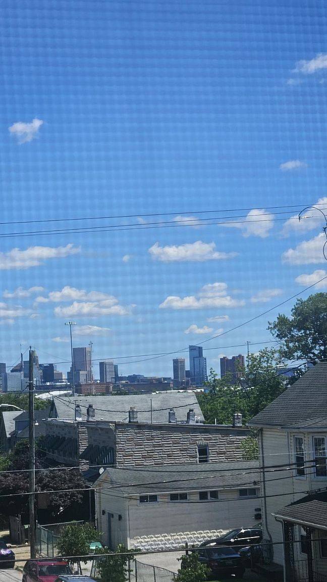 Downtown Baltimore skyline seen from an upstairs window